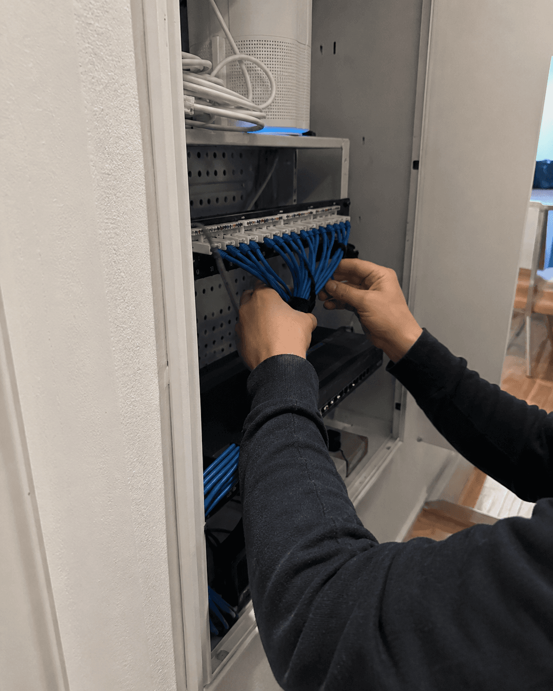 Patch cables being organized inside a network cabinet